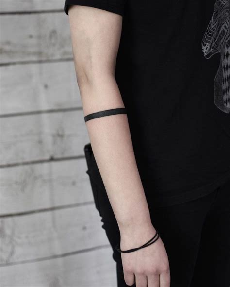 black forearm band tattoo|solid black tattoo sleeve meaning.